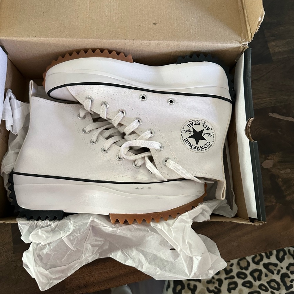 Never worn pair of platform white high top converse size 7